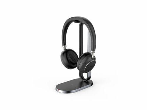 Wireless headphones on stand, white background.
