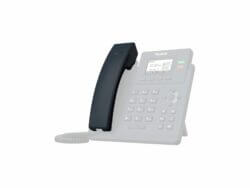 Yealink office telephone on white background.