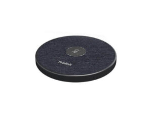 Round Yealink speakerphone on white background.