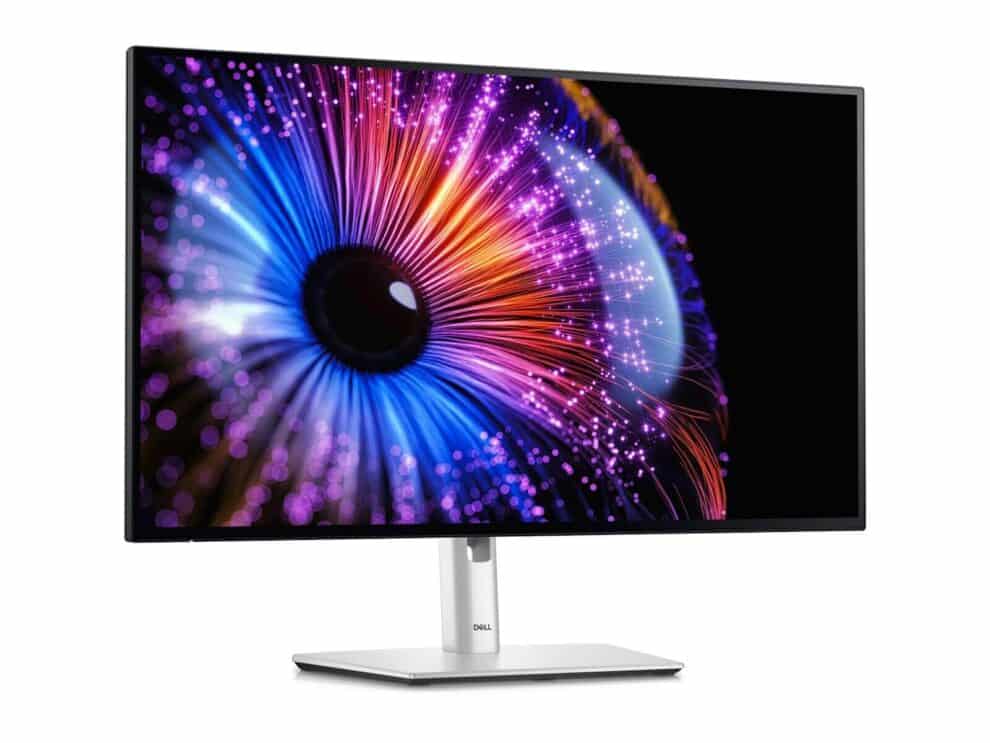 Dell monitor displaying colorful abstract wallpaper.