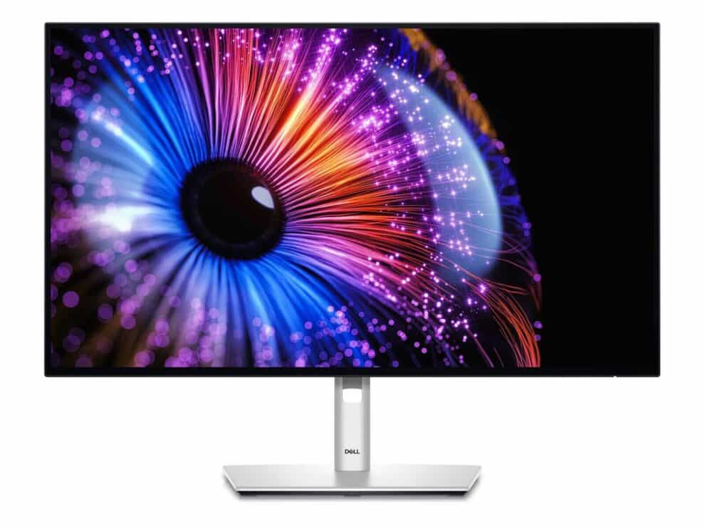 Dell monitor displaying vibrant abstract light explosion graphic.