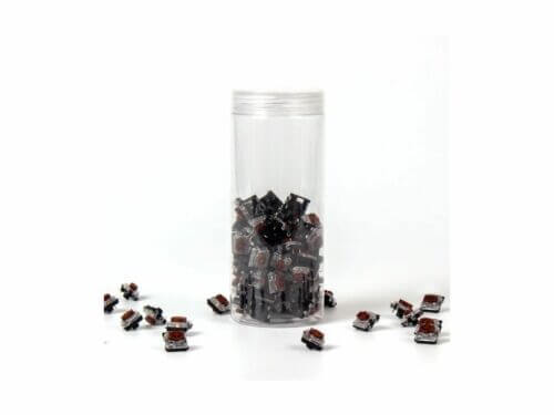 Mechanical keyboard switches in clear container.