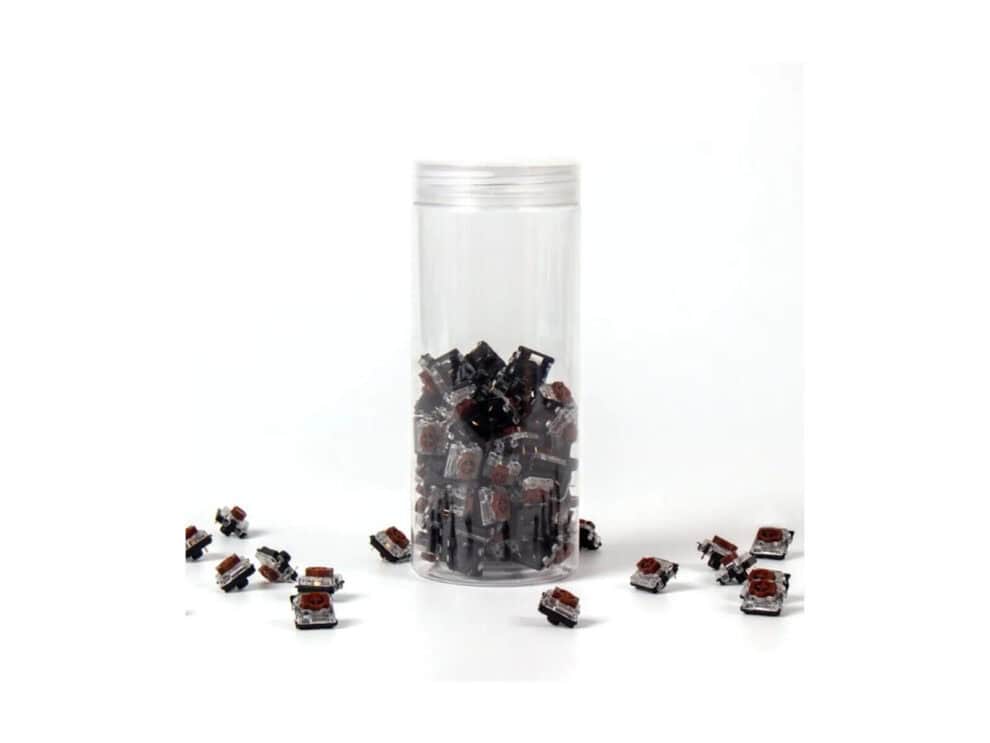 keychron brown gateron low profile switches 110 pcs Mechanical keyboard switches in clear container.