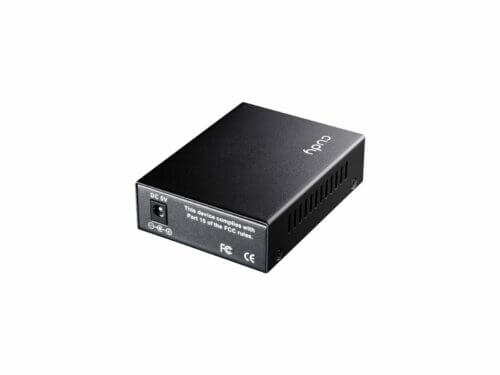 Compact black network switch on white background.
