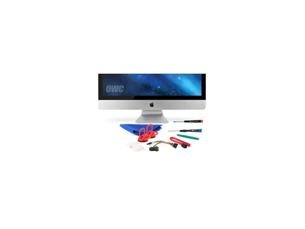 iMac with repair tools on white background.