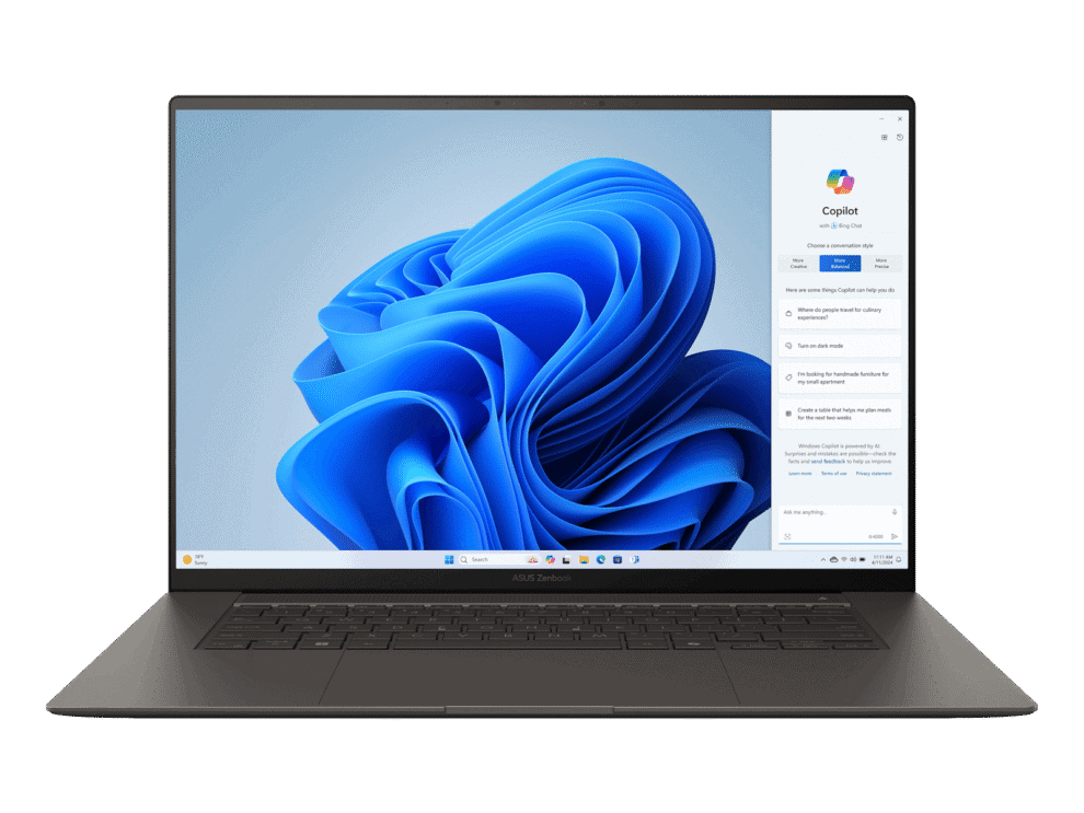 Laptop with Windows 11 and Copilot screen open.