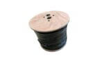 Wooden spool filled with black cable