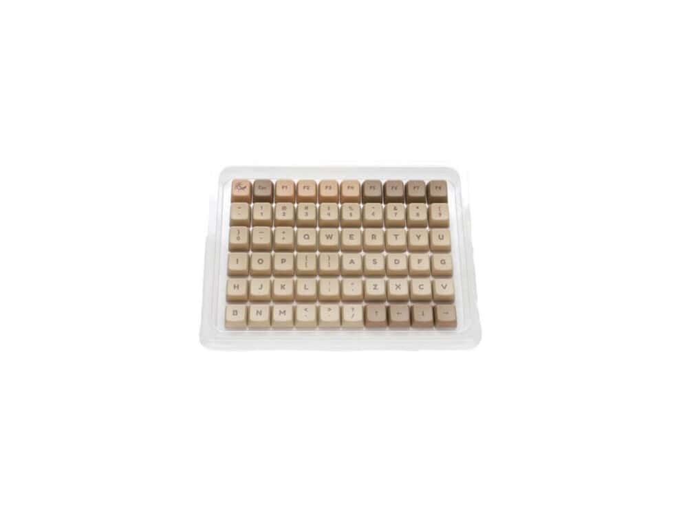 ducky keycap 132 key boba mda profile Beige keycaps set on tray.